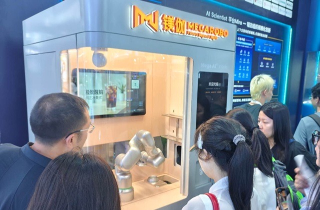 Visitors exploring an exhibition booth at WAIC Shanghai in China